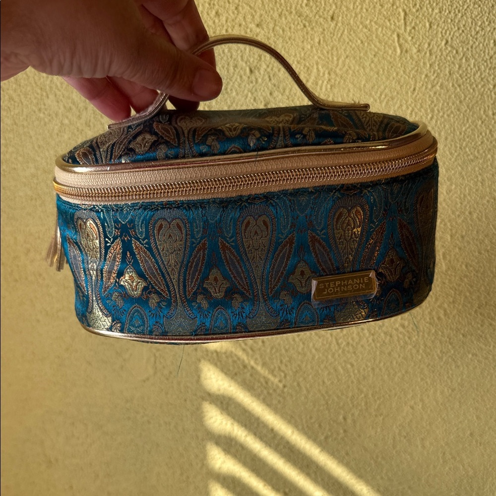 Stephanie Johnson Cosmetics bag with hair clip and Facial mask.